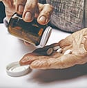 Senior Woman Taking Medicine